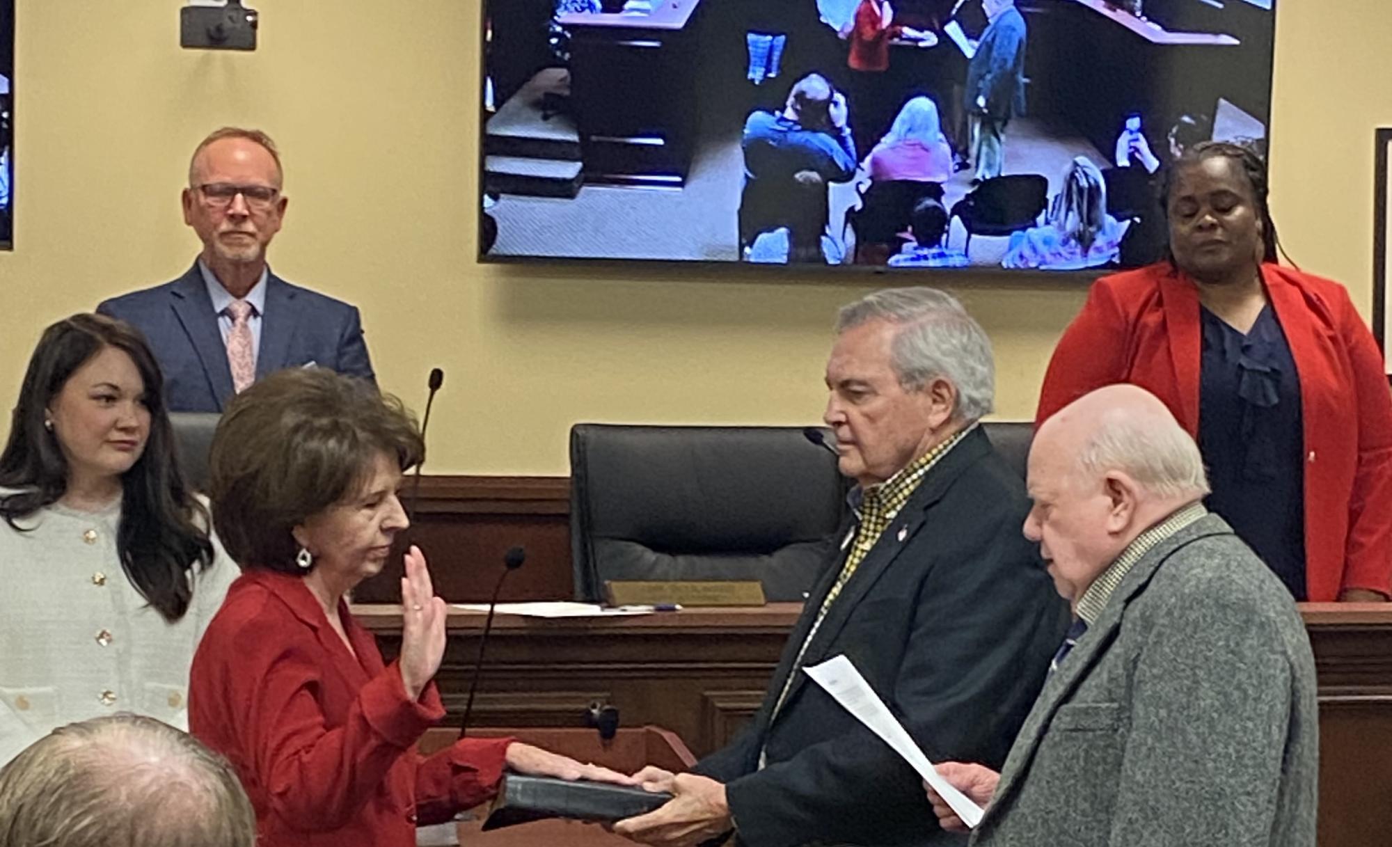 Council Member Peggy Kinlaw being sworn in