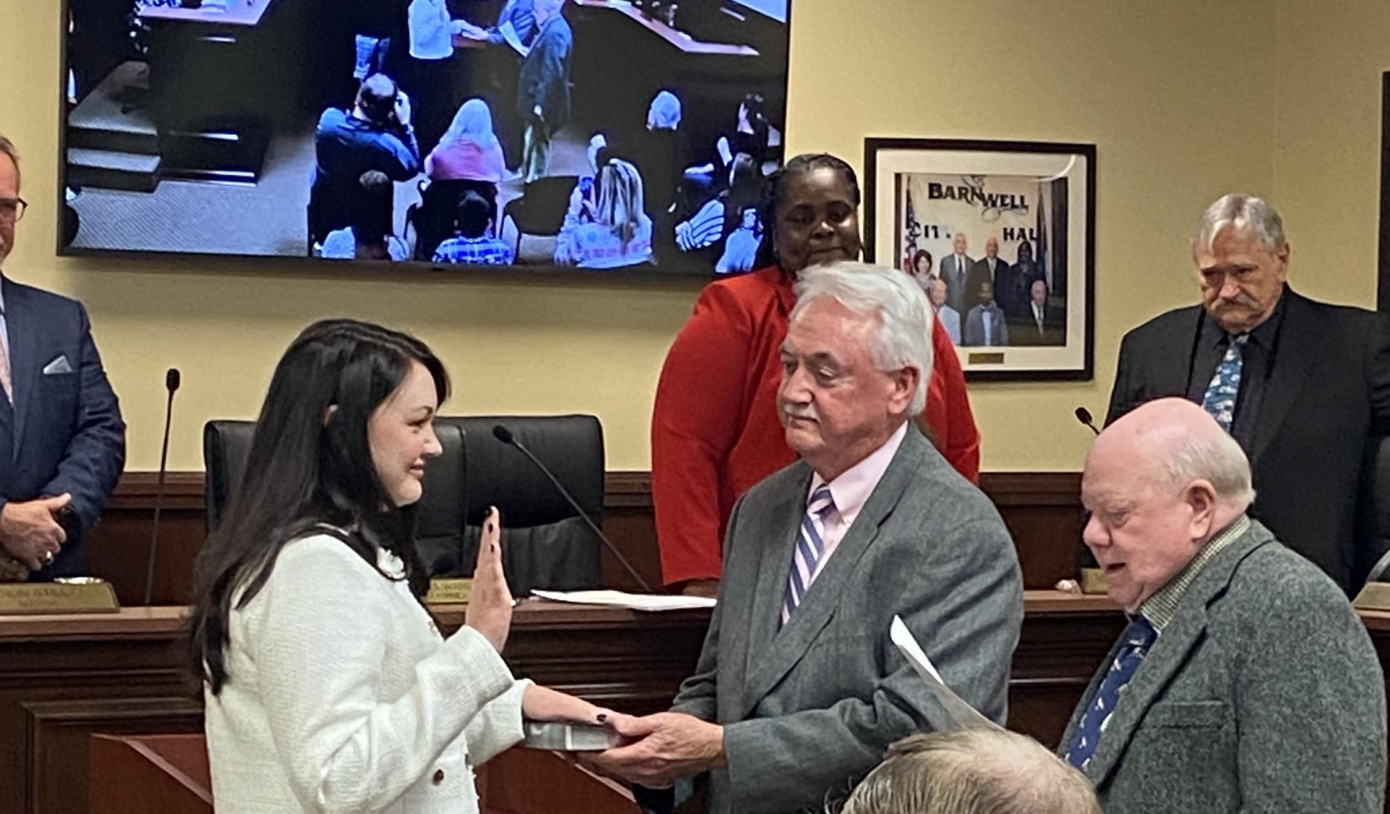 Council Member Jana Myers being sworn in